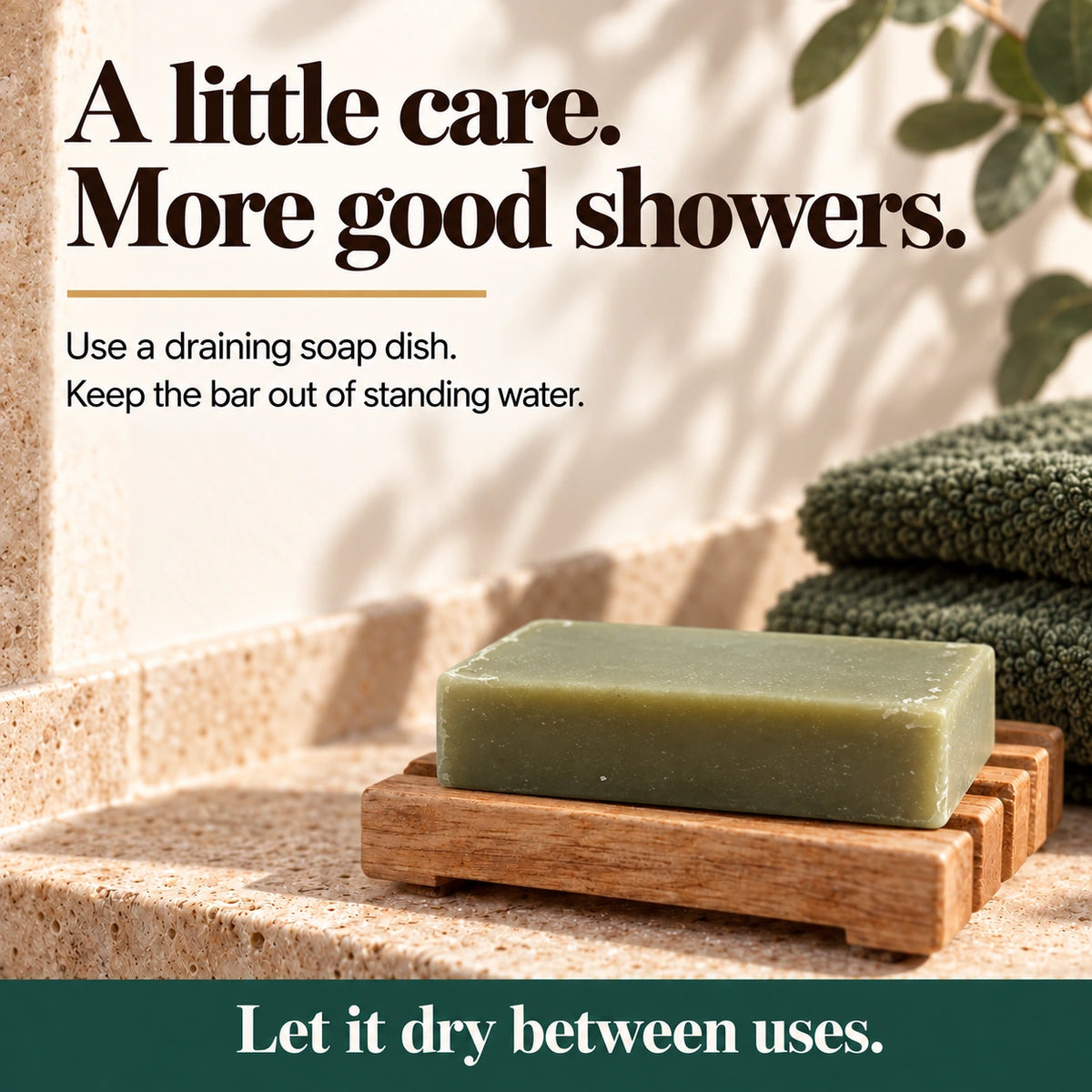 Athlete's Shield soap bar on a draining wooden soap dish beside green towels