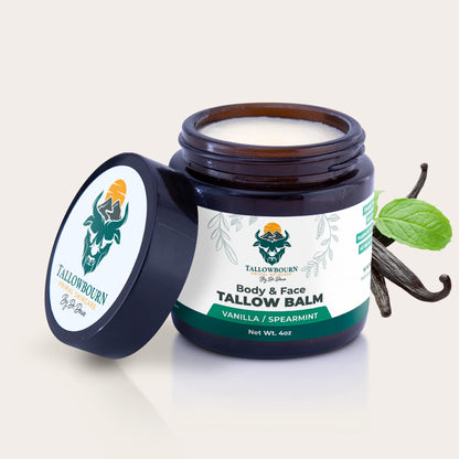 Tallowbourn  balm jar with vanilla bean and spearmint leaf on a light background 